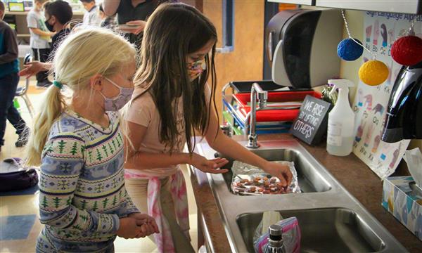 Two girls test aluminum boat